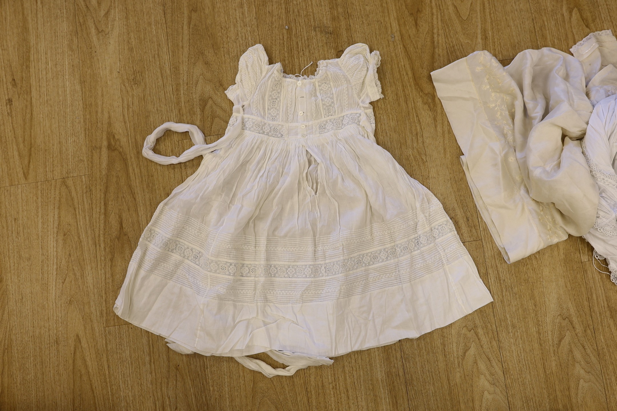 A collection of 19th century cutwork and Ayrshire christening gowns